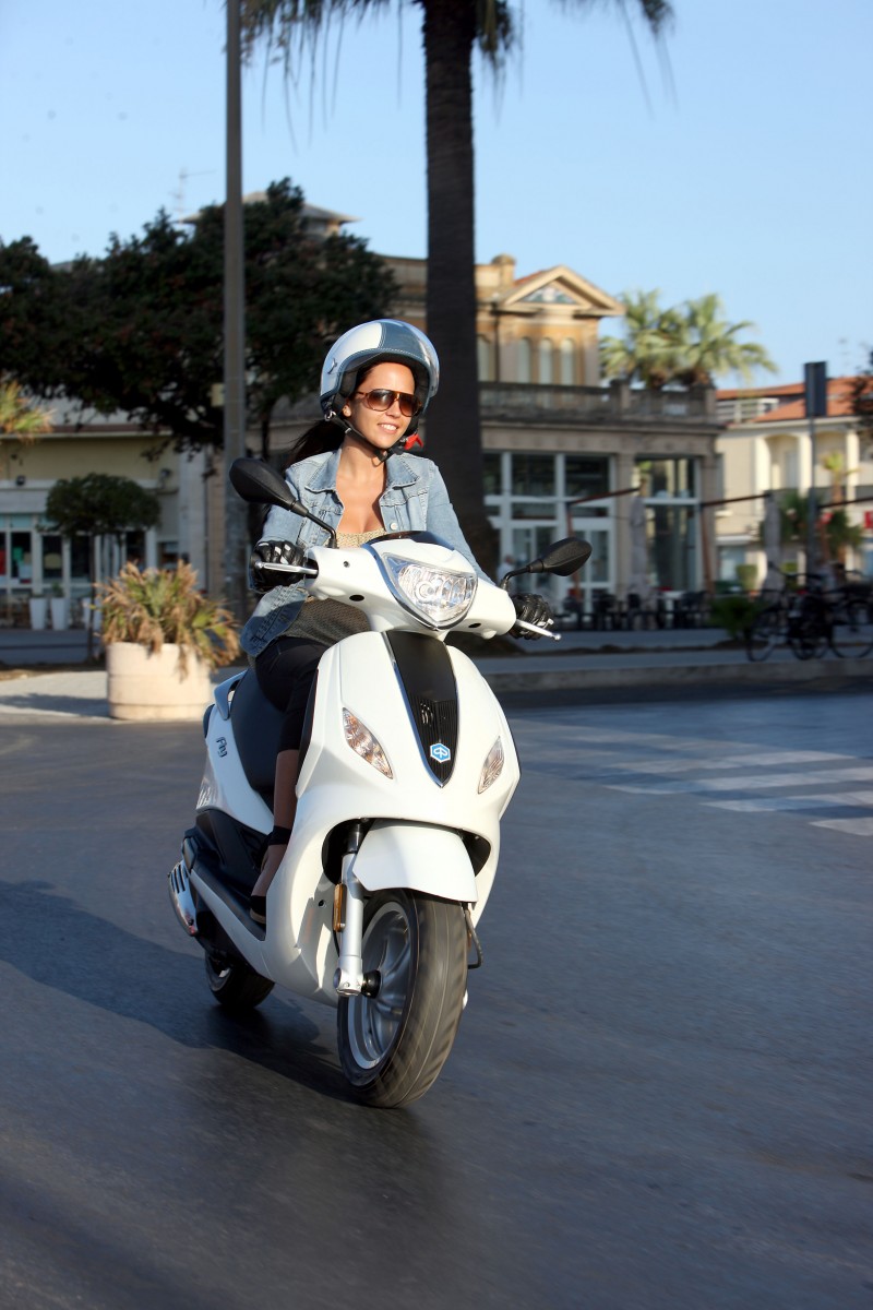 girl riding moped